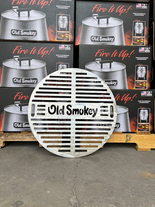 Old Smokey grill grate on a concrete floor with product packaging in the background